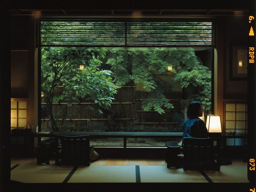 person meditating in quiet room