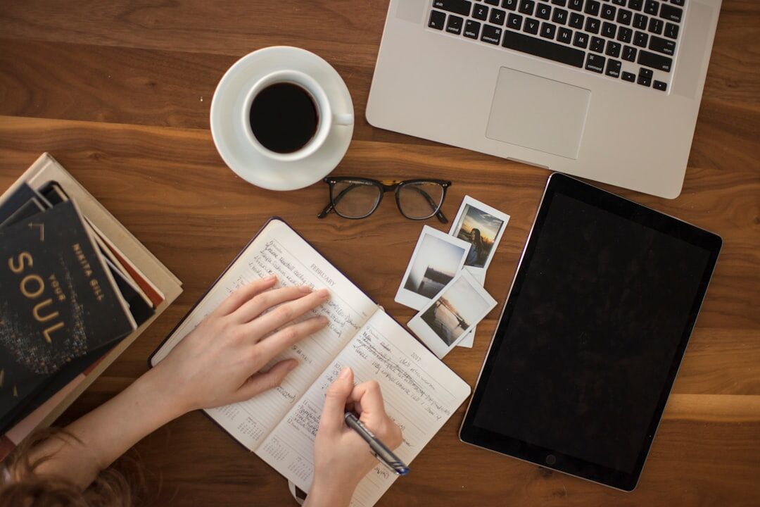 person writing in journal