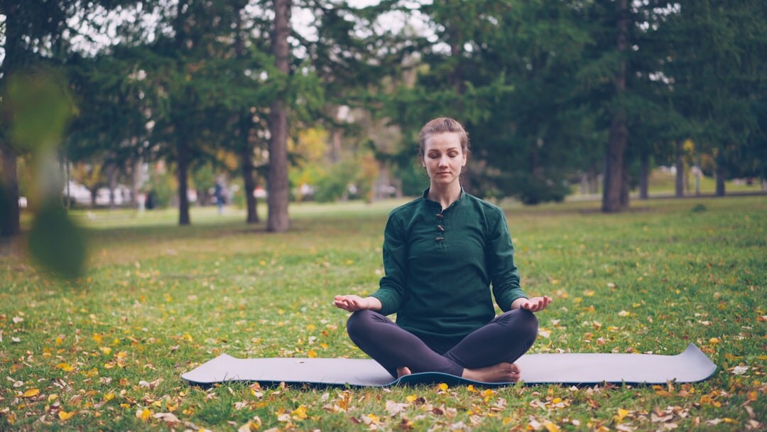 woman doing yoga in park